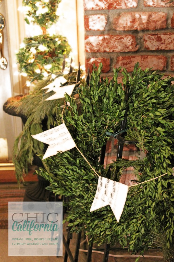 boxwood wreath, front porch decorations, music sheet garland