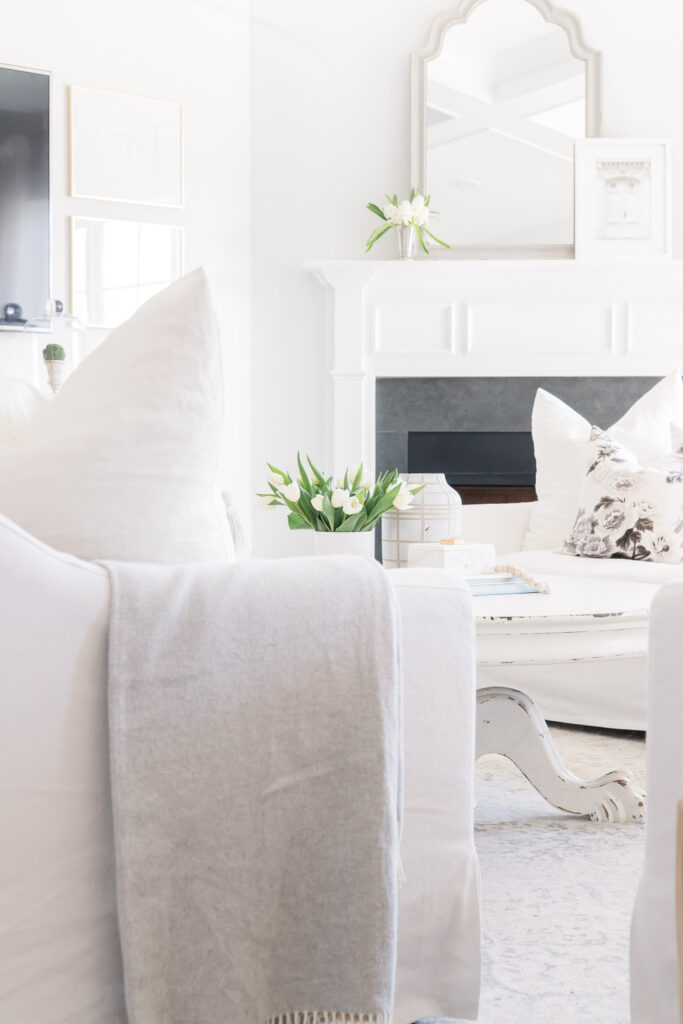 Do you love white bright spaces? You are going to love this Light and Bright Spring Home Tour and spring decorating ideas | Adrienne Elizabeth Home Style Life| #springhometour #springdecor #whitedecor #modernfarmhouse #modernfarmhousestyle #springflowers #springdecorideas #floralpillow #jillianharrisstyle #monikahibbsstyle #whitecouch #studiomcgeestyle #ikeacouch #farlovcouch #vintagedecor 
